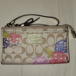 Never used, beige Coach wallet/wristlet.